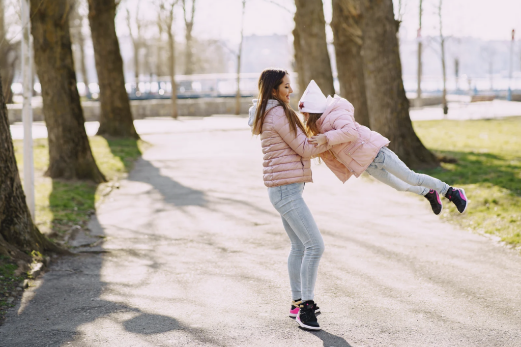 This is a woman playing with her daughter.